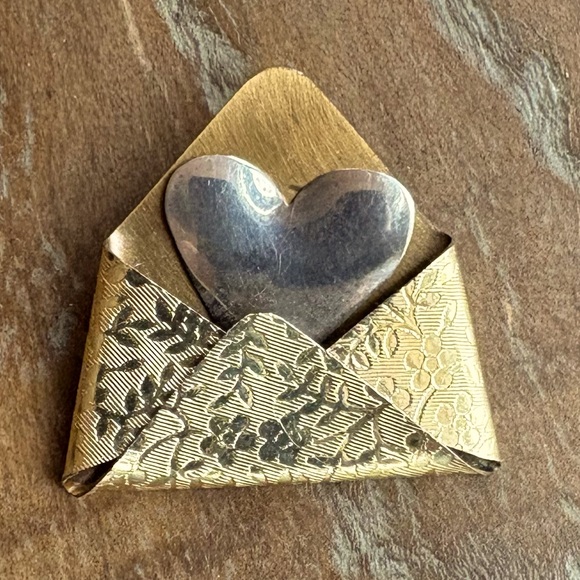 artisan-made Jewelry - Gold-tone embossed metal envelope pin & a silver heart going into the envelope